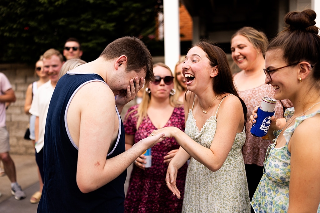 Groom to be proposing during surprise wedding proposal at family home | Emotional reaction during surprise wedding proposal at family home in Missouri | Couple celebrating after surprise wedding proposal at family home | Portraits of newly engaged couple after surprise wedding proposal